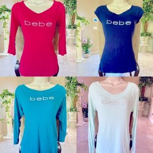 Lot of 4 BEBE rhinestone logo tops